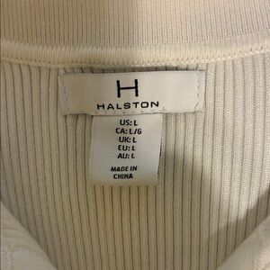 Ribbed sweater with elbow length sleeves.